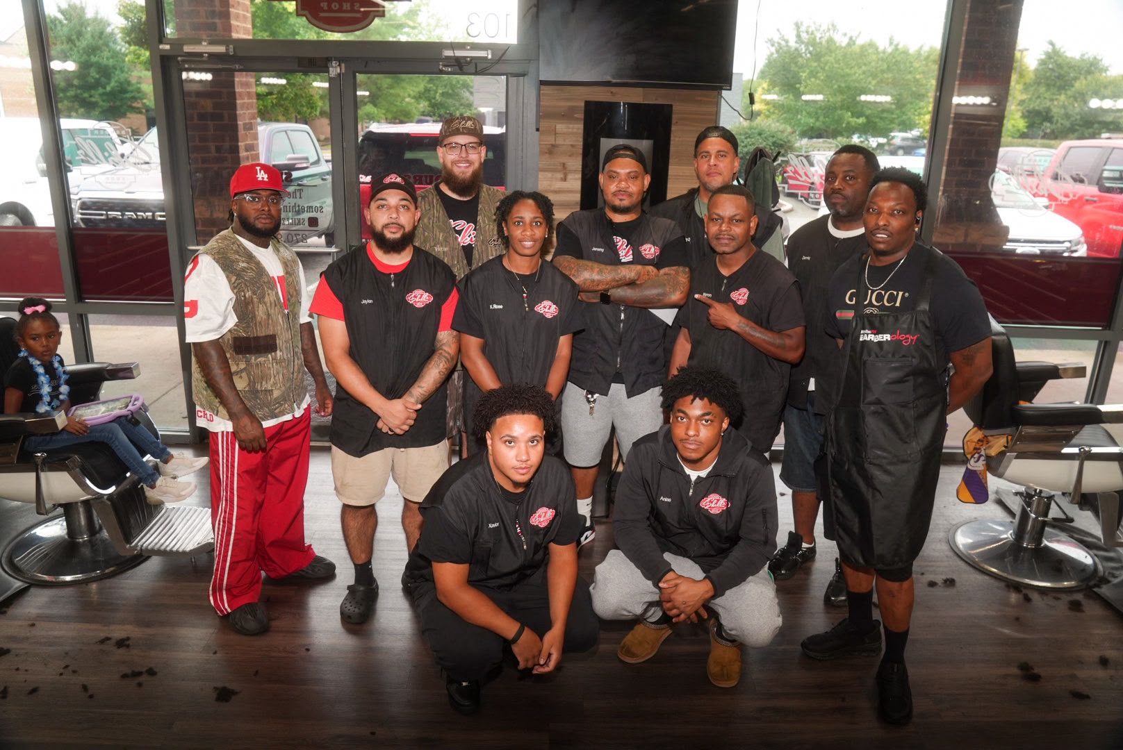 The Skillz Barbershop team standing together inside the shop